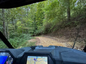 from inside an ATV on a mountain road