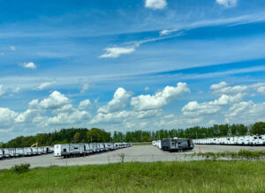 bright blue sky over a parking lot of hundreds of RVs in Indiana